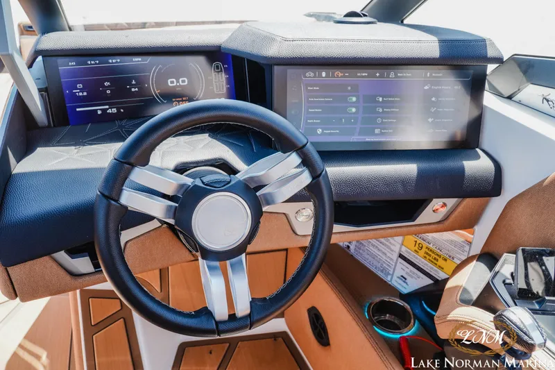 Slide: The Image of 2024 Nautique Super Air Nautique G25 Paragon dashboard with advanced digital displays. - 25