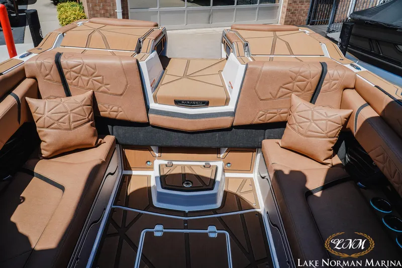 Slide: The Image of Luxurious interior of 2024 Nautique Super Air Nautique G25 Paragon with tan upholstery and cushions. - 34
