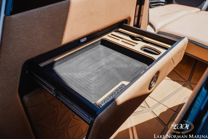 Slide: The Image of 2024 Nautique Super Air Nautique G25 Paragon interior storage compartment with elegant design. - 37