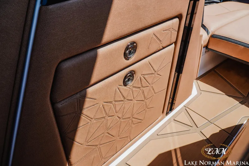 Slide: The Image of Luxurious interior of 2024 Nautique Super Air Nautique G25 Paragon boat with elegant stitching. - 38