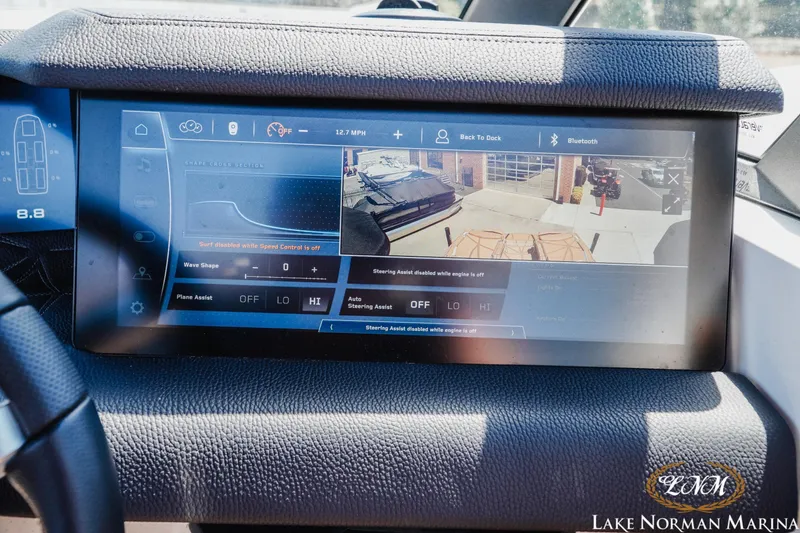 Slide: The Image of 2024 Nautique Super Air Nautique G25 Paragon dashboard with advanced touchscreen controls. - 40