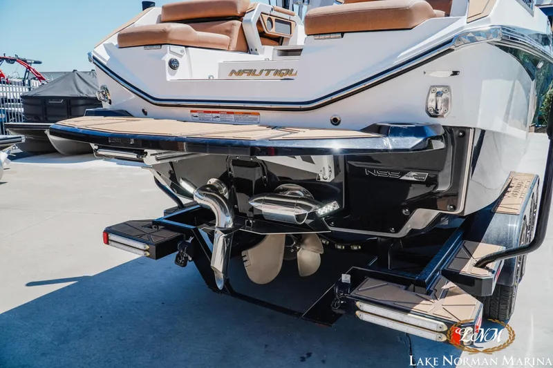 Slide: The Image of 2024 Nautique Super Air Nautique G25 Paragon boat rear view at Lake Norman Marina. - 5