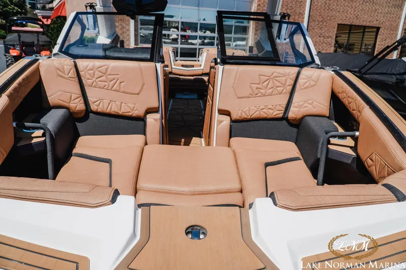 Slide: The Image of 2024 Nautique Super Air Nautique G25 Paragon interior with luxurious tan seating. - 7