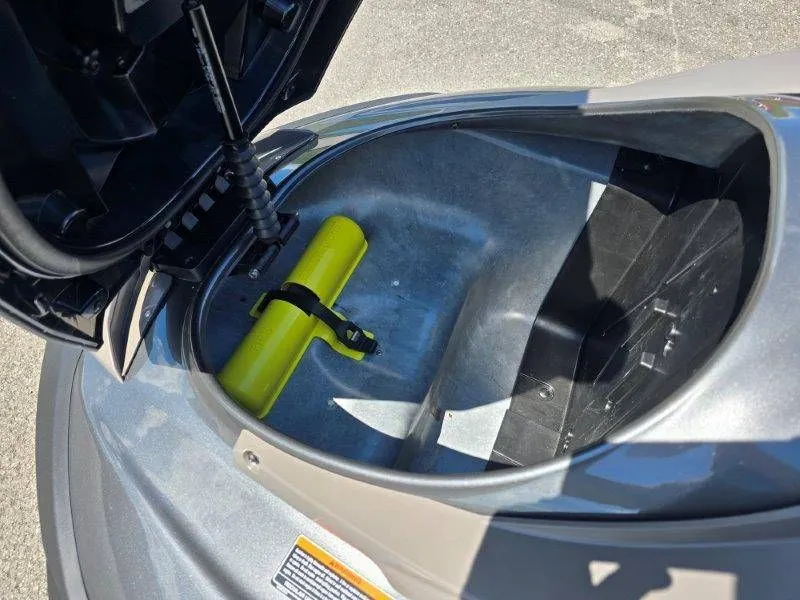 Slide: The Image of Yamaha Waverunner FX HO 2025 storage compartment with yellow accessory. - 22