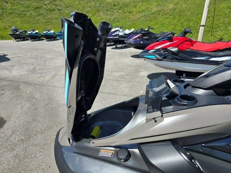 Slide: The Image of 2025 Yamaha Waverunner FX HO with open storage compartment lid. - 29