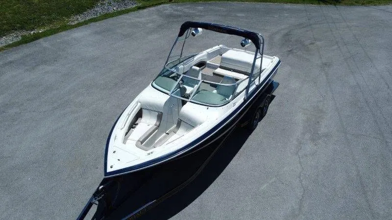 Slide: The Image of 2006 Cobalt 246 boat parked on asphalt, aerial view. - 17