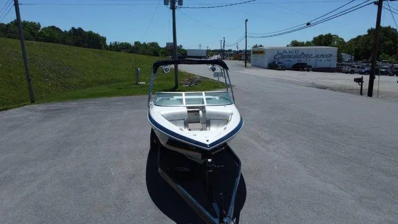 Slide: The Image of 2006 Cobalt 246 boat parked on a trailer. - 20