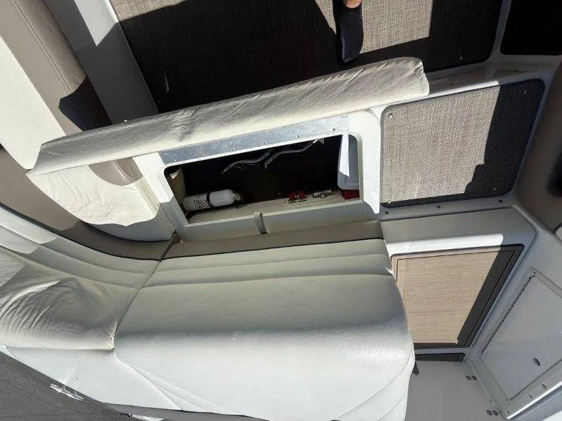 Slide: The Image of Interior of a 2006 Cobalt 246 boat with seating and storage. - 23