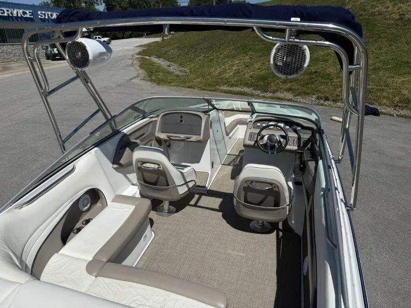 Slide: The Image of Interior of a 2006 Cobalt 246 boat with seating and helm. - 24