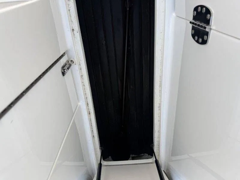 Slide: The Image of Interior of a 2006 Cobalt 246 boat, black and white details. - 25