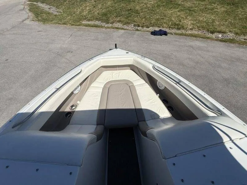 Slide: The Image of Interior view of a 2006 Cobalt 246 boat with beige seating. - 27