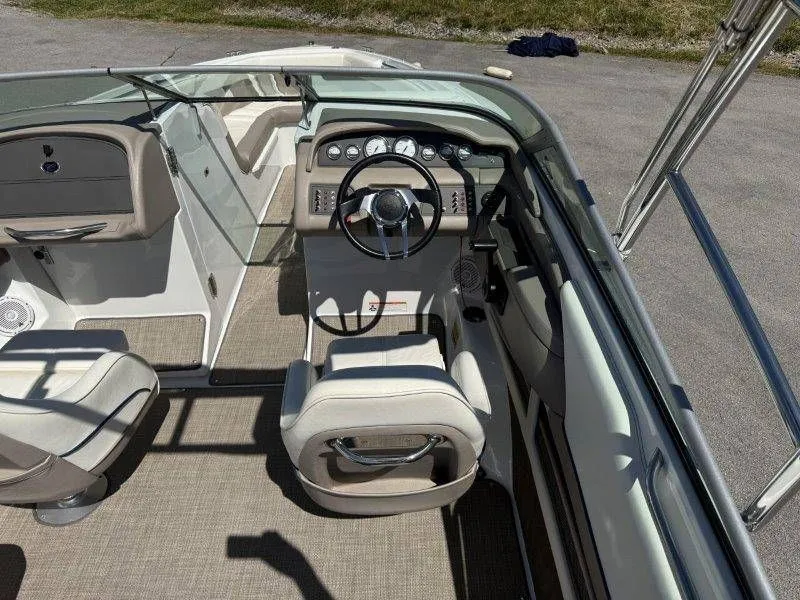 Slide: The Image of Interior of a 2006 Cobalt 246 boat with steering console. - 30