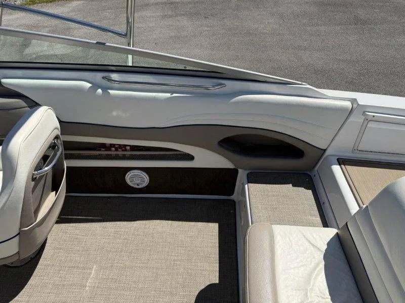 Slide: The Image of Interior of a 2006 Cobalt 246 boat with beige seating. - 31