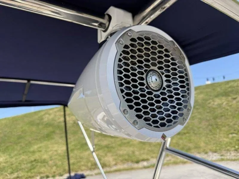Slide: The Image of Speaker on a 2006 Cobalt 246 boat, mounted under a blue canopy. - 32