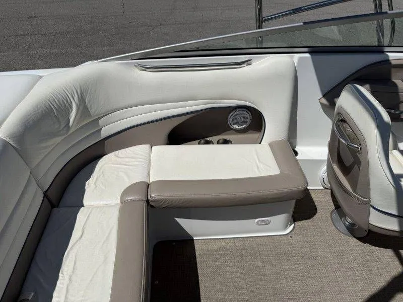 Slide: The Image of Interior of a 2006 Cobalt 246 boat with beige and white seating. - 34