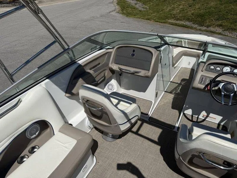 Slide: The Image of Interior of a 2006 Cobalt 246 boat with sleek seating and helm console. - 38