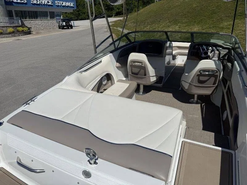 Slide: The Image of Interior view of a 2006 Cobalt 246 boat with white seating. - 41