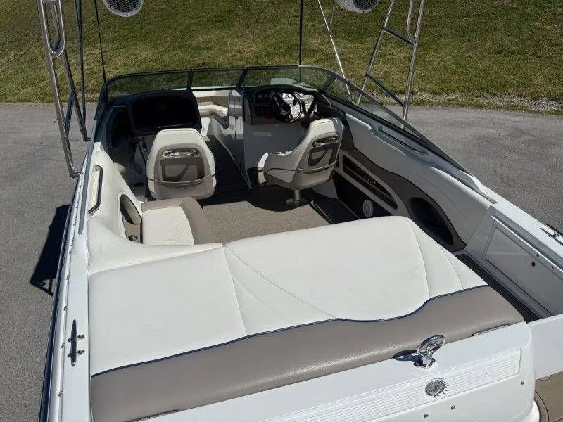 Slide: The Image of Interior view of a 2006 Cobalt 246 boat with white seating. - 42