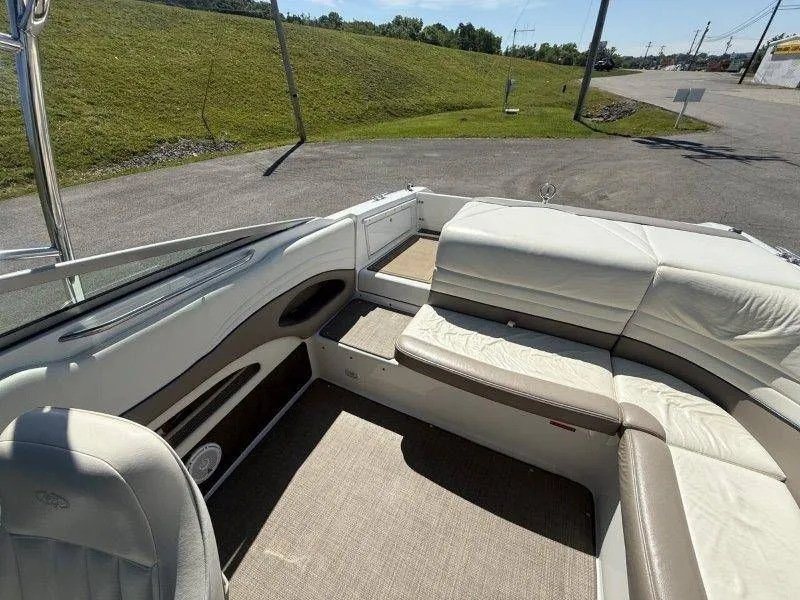 Slide: The Image of Interior of a 2006 Cobalt 246 boat with beige seating. - 45
