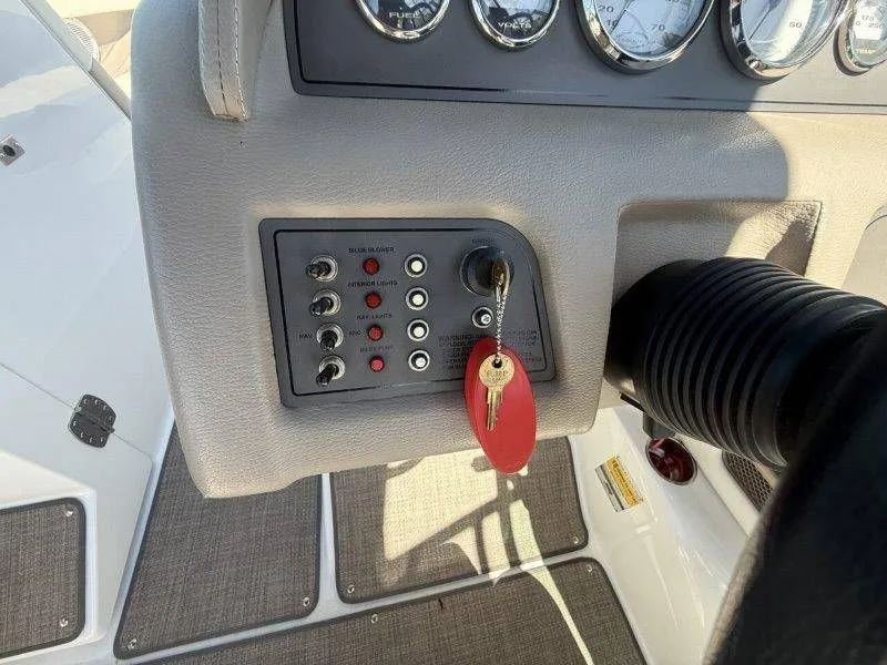 Slide: The Image of Dashboard of a 2006 Cobalt 246 boat with key ignition. - 48