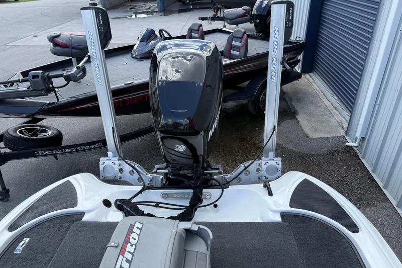 Slide: The Image of 2007 Triton TR-196 boat with Mercury engine and Minn Kota trolling motors in storage. - 15