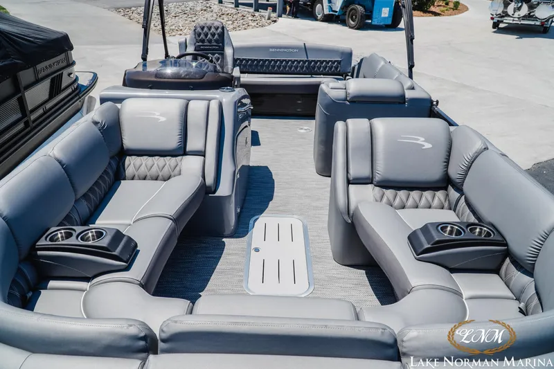 Slide: The Image of 2020 Bennington 25QXSBIO pontoon boat with luxurious seating and cup holders at Lake Norman Marina. - 14