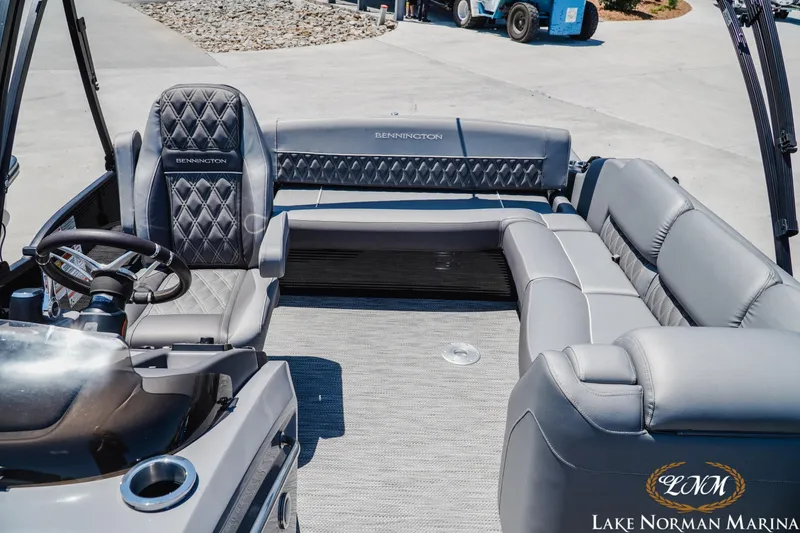 Slide: The Image of 2020 Bennington 25QXSBIO pontoon boat interior with luxurious seating at Lake Norman Marina. - 16