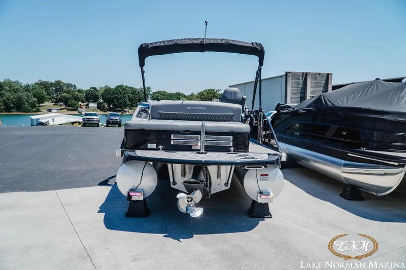 Slide: The Image of 2020 Bennington 25QXSBIO pontoon boat at Lake Norman Marina, parked on a sunny day. - 5