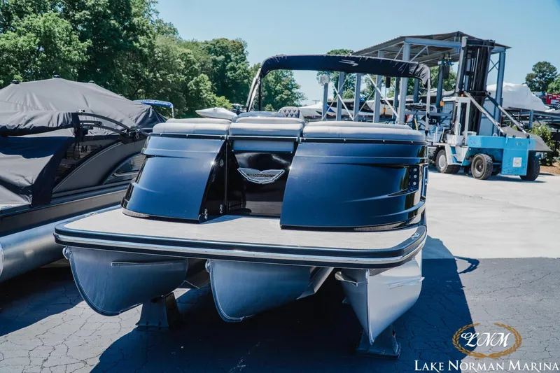 Slide: The Image of 2020 Bennington 25QXSBIO pontoon boat at Lake Norman Marina, displayed outdoors. - 6