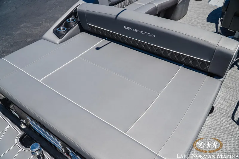 Slide: The Image of 2020 Bennington 25QXSBIO boat with spacious gray seating and cup holders. - 8