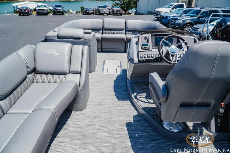 Slide: The Image of 2020 Bennington 25QXSBIO pontoon boat interior with luxurious seating and modern helm. - 9
