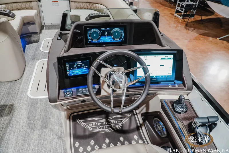 Slide: The Image of Luxurious 2026 Bennington 27QXSBAT2 boat dashboard with advanced digital displays and controls. - 14