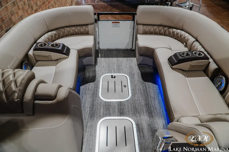 Slide: The Image of Luxurious interior of 2026 Bennington 27QXSBAT2 pontoon boat with plush seating and cup holders. - 18