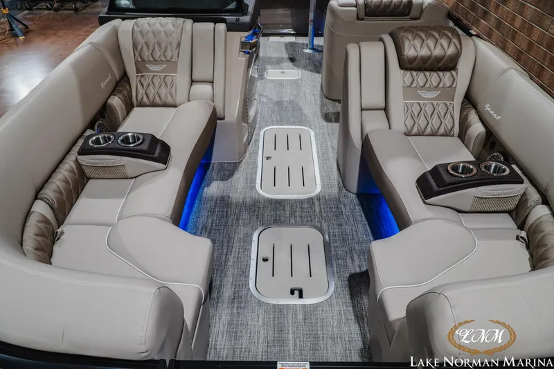 Slide: The Image of Luxurious interior of 2026 Bennington 27QXSBAT2 pontoon boat with plush seating and cup holders. - 19
