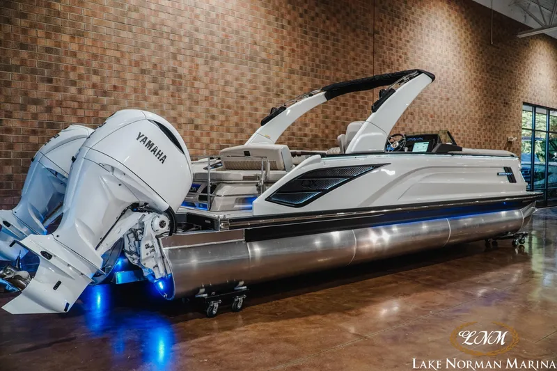 Slide: The Image of 2026 Bennington 27QXSBAT2 pontoon boat with Yamaha engines at Lake Norman Marina. - 2