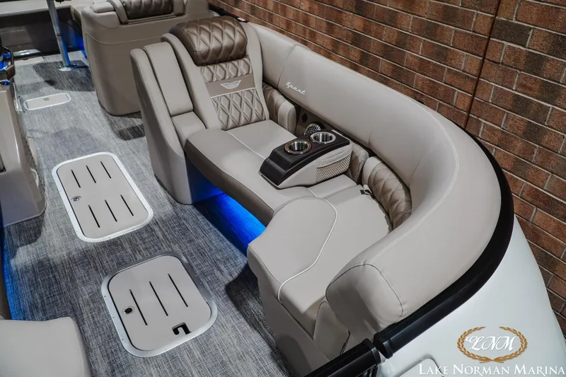 Slide: The Image of Luxurious interior of 2026 Bennington 27QXSBAT2 boat with plush seating and cup holders. - 20