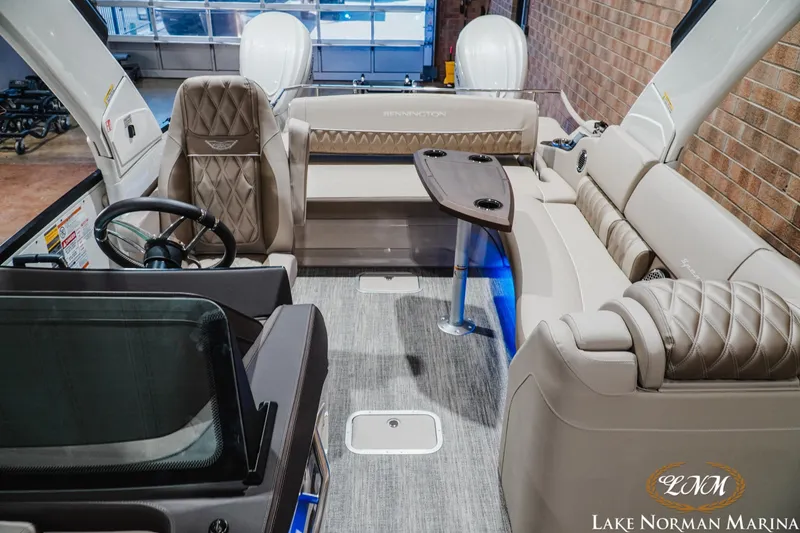 Slide: The Image of Luxurious interior of 2026 Bennington 27QXSBAT2 boat with plush seating and modern design. - 23