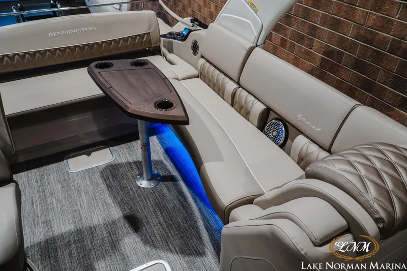 Slide: The Image of Luxurious interior of 2026 Bennington 27QXSBAT2 pontoon boat with elegant seating and table. - 24