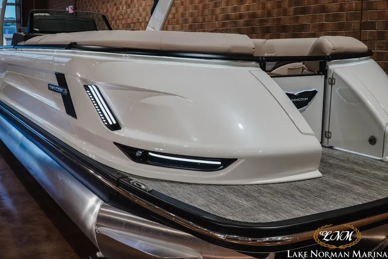 Slide: The Image of 2026 Bennington 27QXSBAT2 pontoon boat with sleek design at Lake Norman Marina. - 5