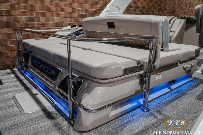Slide: The Image of 2026 Bennington 27QXSBAT2 boat with luxurious seating and ambient blue lighting. - 7