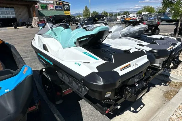 Slide: The Image of 2026 Sea-Doo PWC GTI 130 WH IBR 26 STD in parking lot. - 22