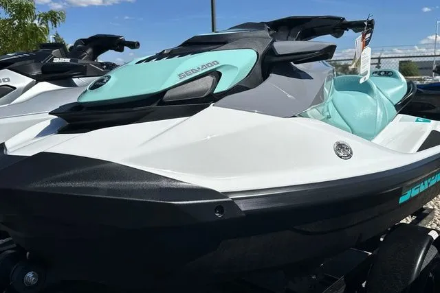 Slide: The Image of 2026 Sea-Doo PWC GTI 130 WH IBR 26 STD in turquoise and white. - 24