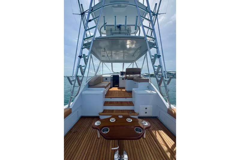 Slide: The Image of 2006 Miller Marine 36 yacht interior with wooden deck and seating area. - 12