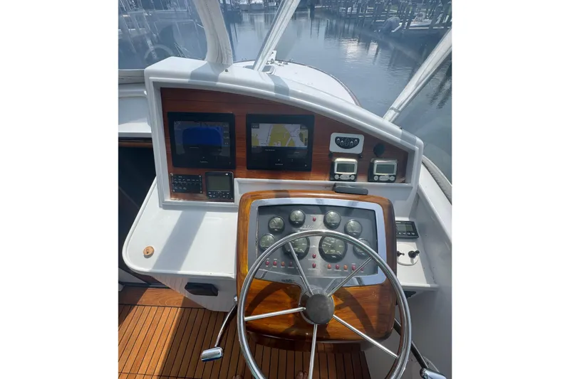 Slide: The Image of Helm of 2006 Miller Marine 36 boat with navigation instruments and steering wheel. - 17