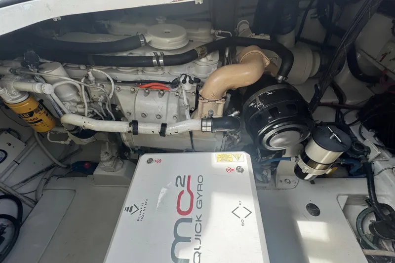 Slide: The Image of Engine compartment of a 2006 Miller Marine 36 boat with visible components and Quick Gyro system. - 21