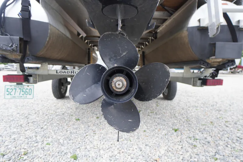 Slide: The Image of 2023 Bennington S 18 Fishing boat propeller on trailer, close-up view. - 10
