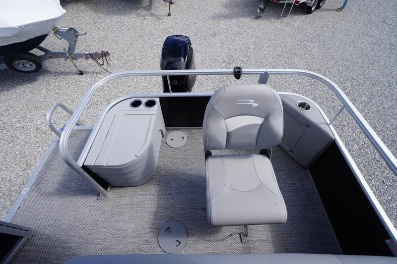 Slide: The Image of 2023 Bennington S 18 Fishing boat interior with seating and storage compartments. - 14
