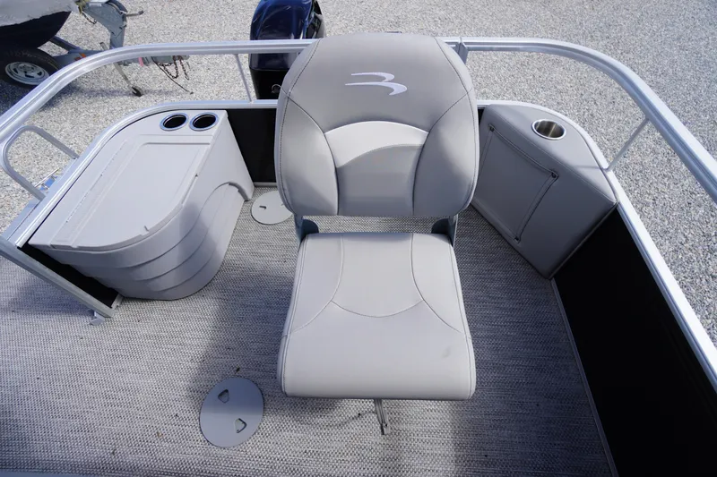 Slide: The Image of 2023 Bennington S 18 Fishing boat interior with seating and storage compartments. - 15