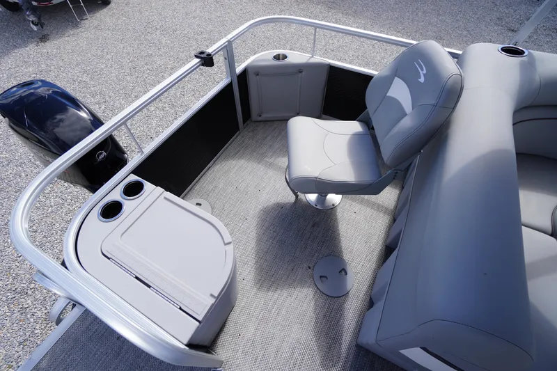 Slide: The Image of 2023 Bennington S 18 Fishing boat interior with seating and storage compartments. - 16
