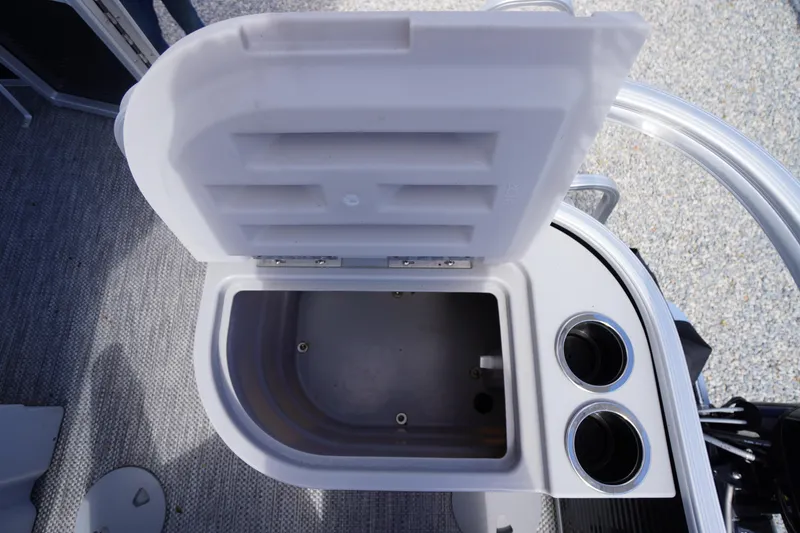 Slide: The Image of Open storage compartment with cup holders on 2023 Bennington S 18 Fishing boat. - 18